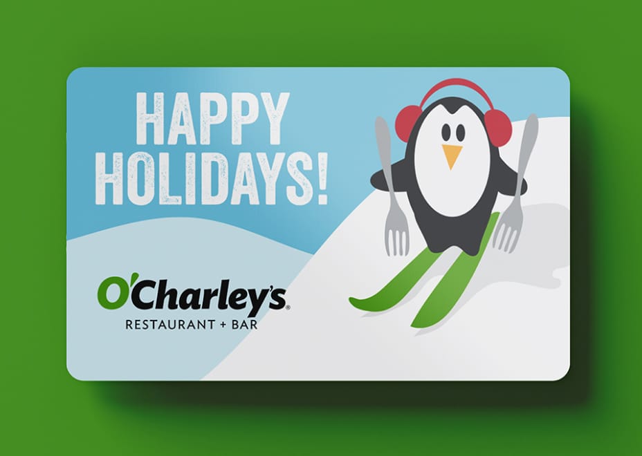 O'Charley's holiday gift card with illustrated skiing penguin